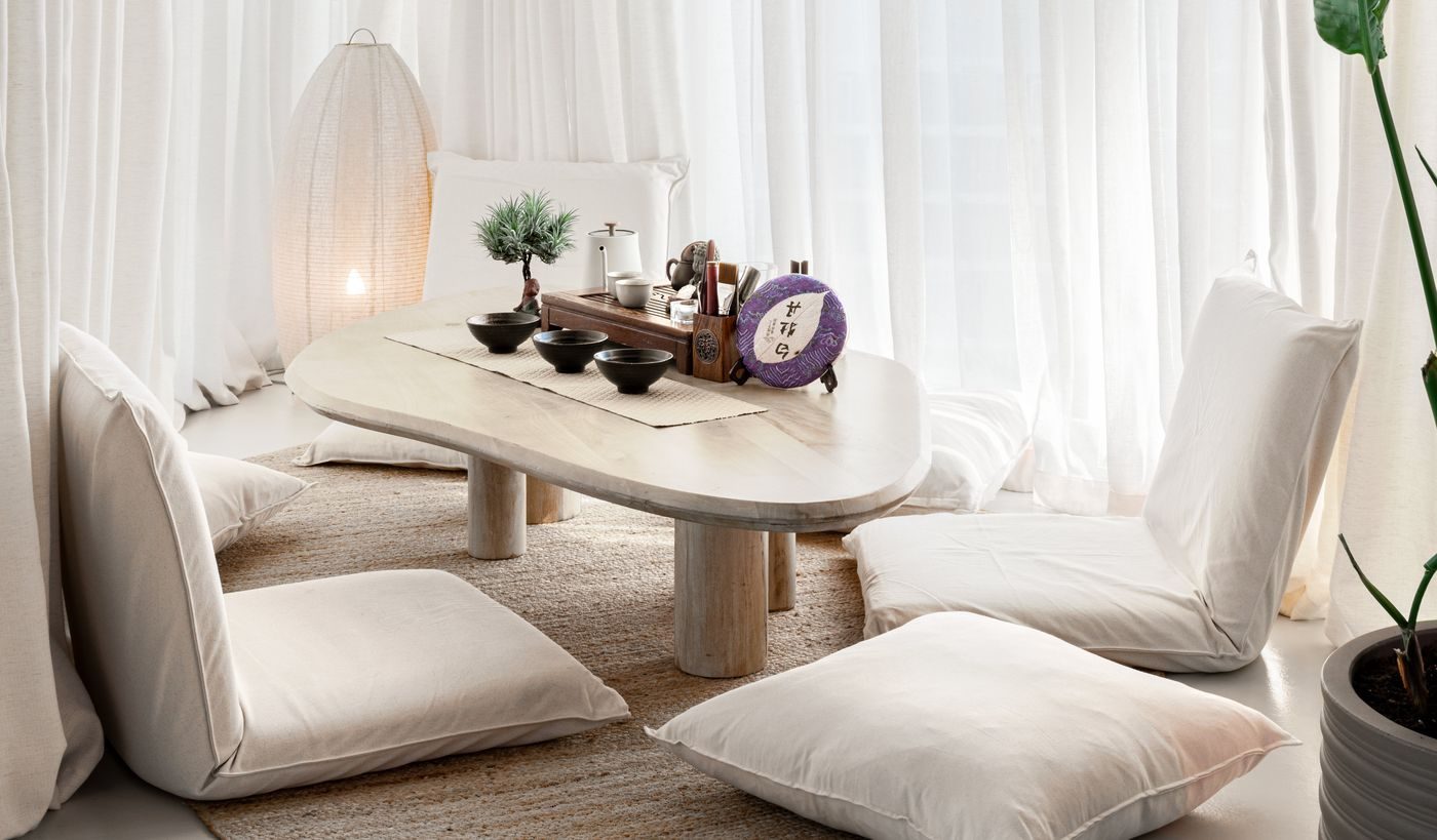 Tea ceremony area — low table, floor cushions and paper lantern